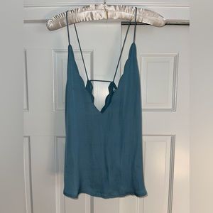 Blue/ teal silk top with scalloped detailing.